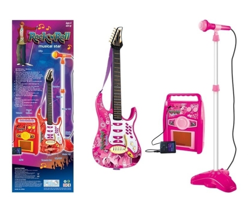 Pink electric guitar with microphone and amplifier