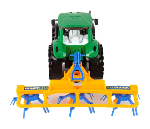 Green Tractor with Orange and Blue Rake Friction Drive