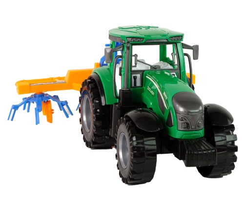 Green Tractor with Orange and Blue Rake Friction Drive