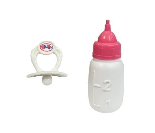 Baby Doll with a pacifier and bottle of milk