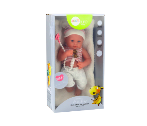 Baby doll in white and pink clothes, hat, pacifier, and blanket