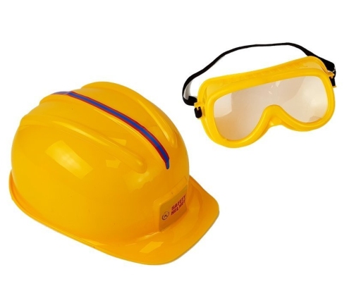 Set of tools, saw with batteries, helmet, gloves and safety glasses