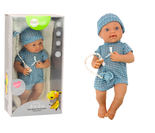 Baby doll in blue clothes, hat, pacifier, and blanket