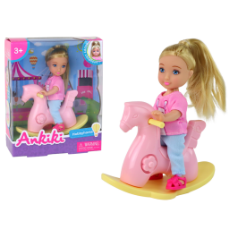 Baby doll for children on a rocking chair, pink rocking horse