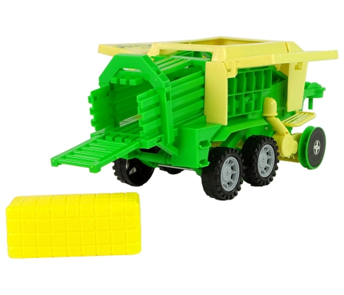 Green tractor with baler friction drive