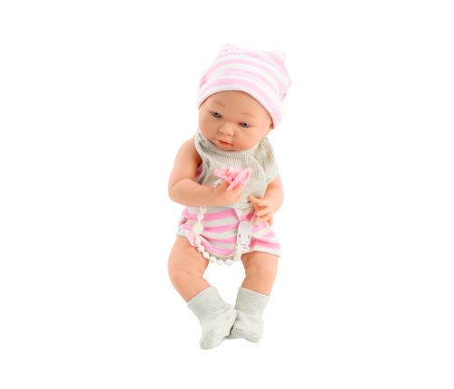 Baby doll in white and pink clothes, hat, pacifier, bib, quilt