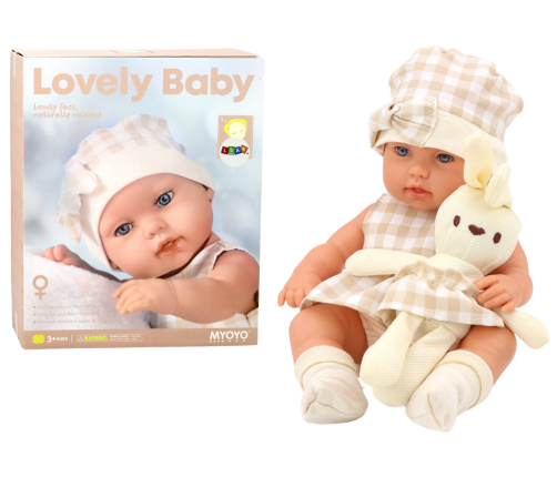 Baby doll in a carrier, a bunny, in a checkered outfit, beige