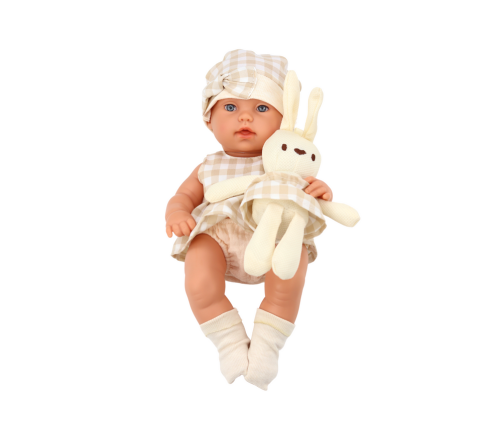 Baby doll in a carrier, a bunny, in a checkered outfit, beige