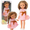 Doll in a pink dress with a bow, long brown hair